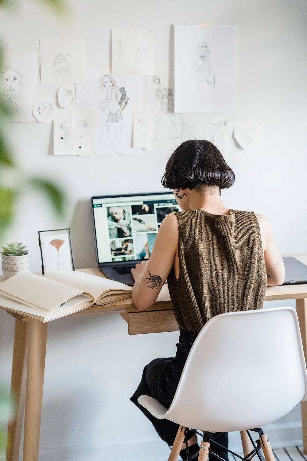 Designer developing apparel concepts at a studio desk